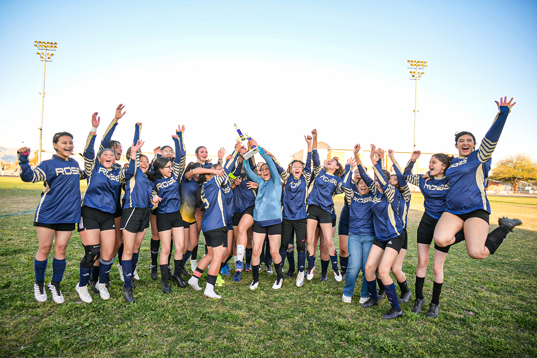 The girls team jumps for joy after their win