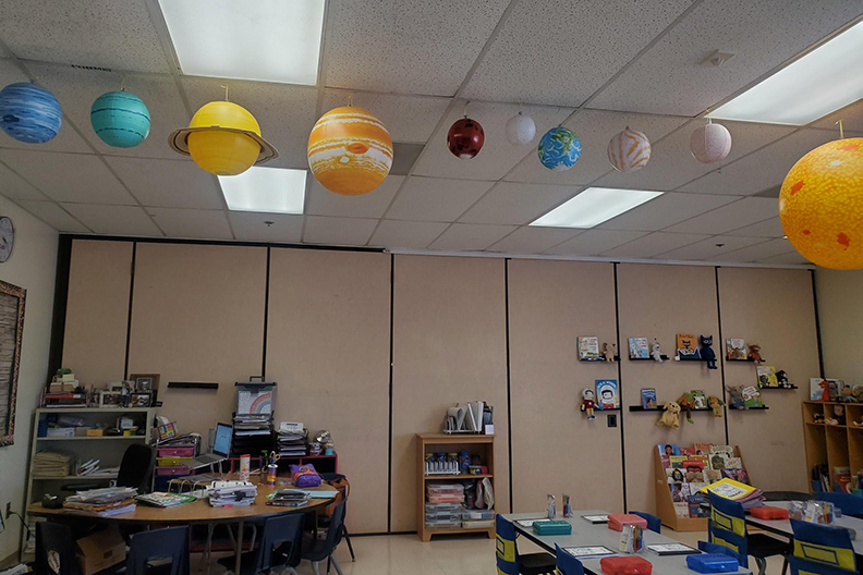 A classroom decorated with the planets of the solar system