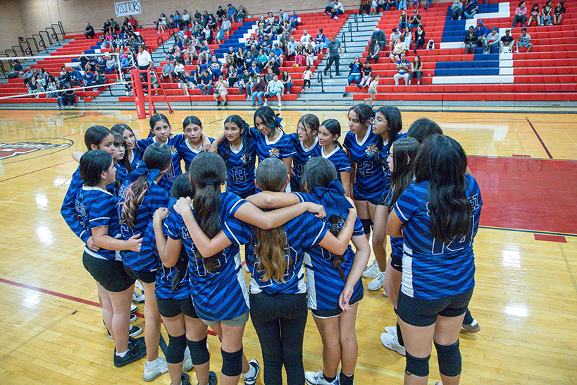 The CE Rose girls volleyball team goes in for a huddle