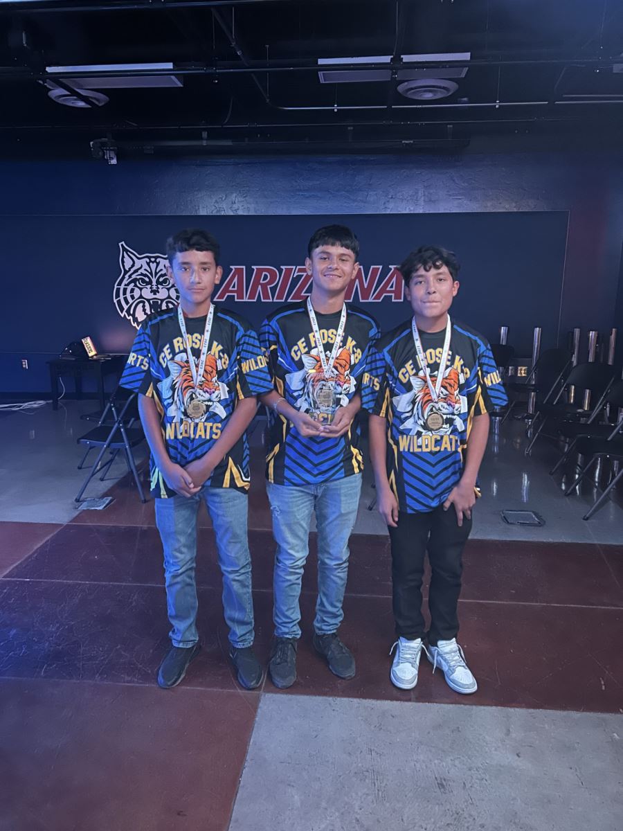 Three students show off their gold medals